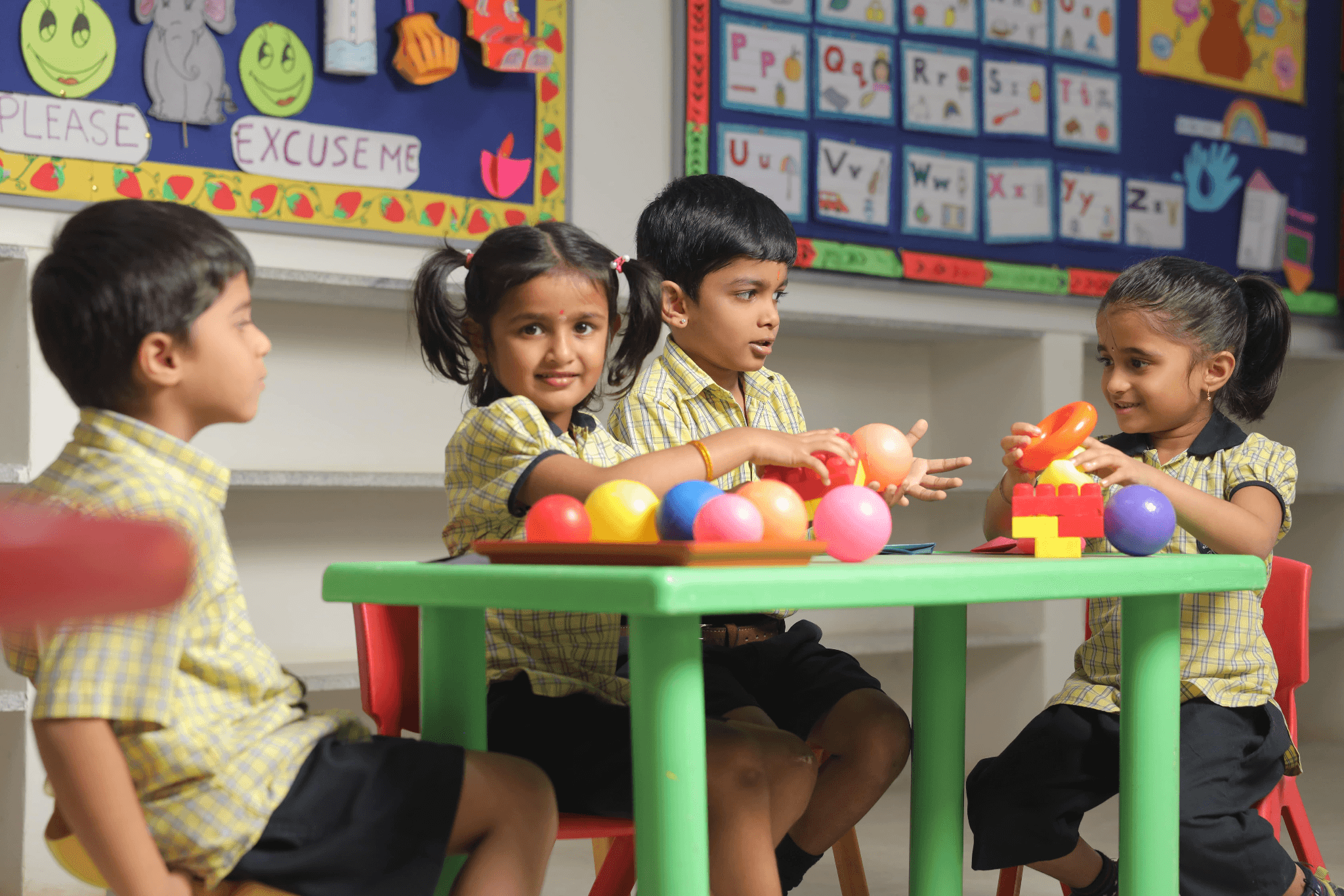 Curious children learning at MG Kids